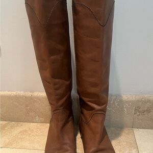 Chanel brown Calfskin leather riding boot with black rimmed leather sole.